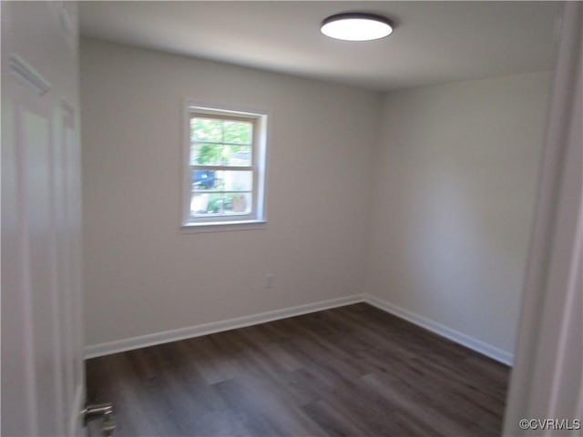 135 Trudie Dr, Center Cross, VA 22437 - empty room featuring dark wood-style flooring and baseboards