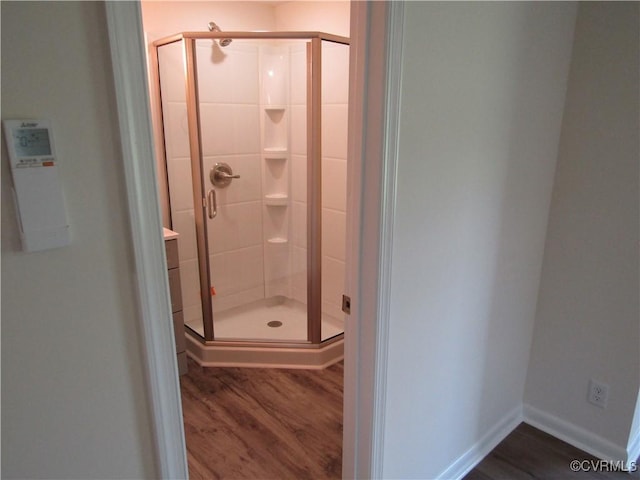 135 Trudie Dr, Center Cross, VA 22437 - full bath featuring wood finished floors and a shower stall