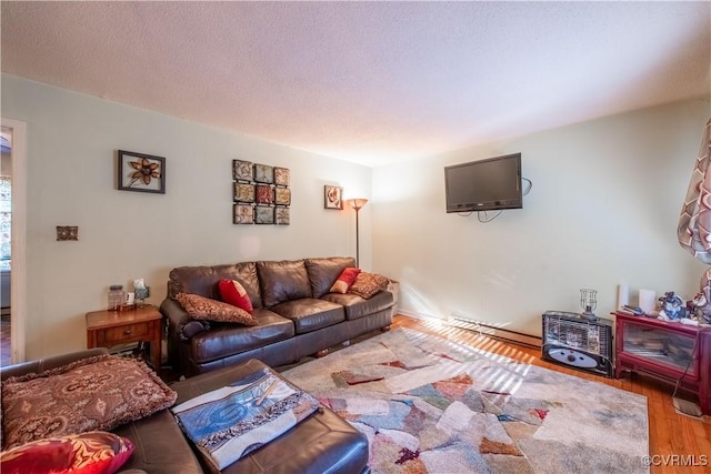18517 Depot Rd, Mc Kenney, VA 23872 - living room featuring wood finished floors and baseboard heating