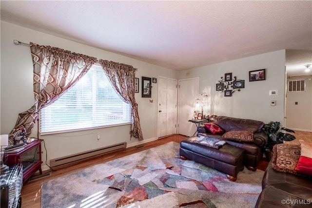 18517 Depot Rd, Mc Kenney, VA 23872 - living area with baseboard heating and wood finished floors