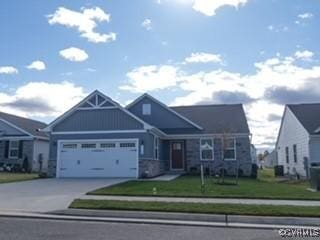 7128 Iron Gall Ln, Ruther Glen, VA 22546 - view of front of house featuring a garage, concrete driveway, and a front lawn