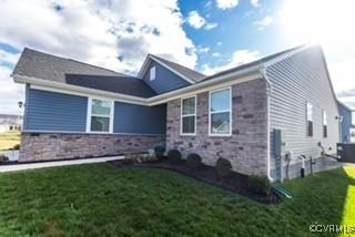 7128 Iron Gall Ln, Ruther Glen, VA 22546 - view of front of property featuring stone siding and a front yard