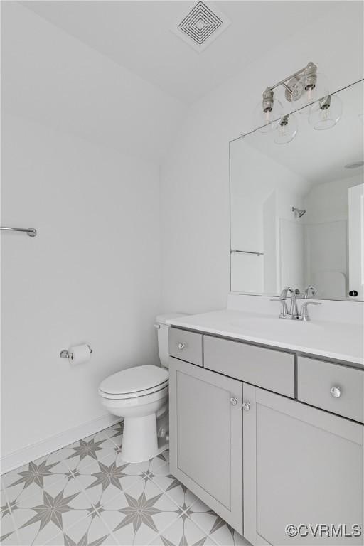 16300 Cambian Ln, Chesterfield, VA 23832 - bathroom with toilet, vanity, and vaulted ceiling