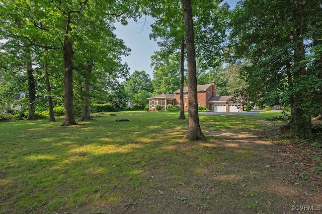 5055 Edgemere Blvd, North Chesterfield, VA 23234 - view of green lawn with a garage and driveway