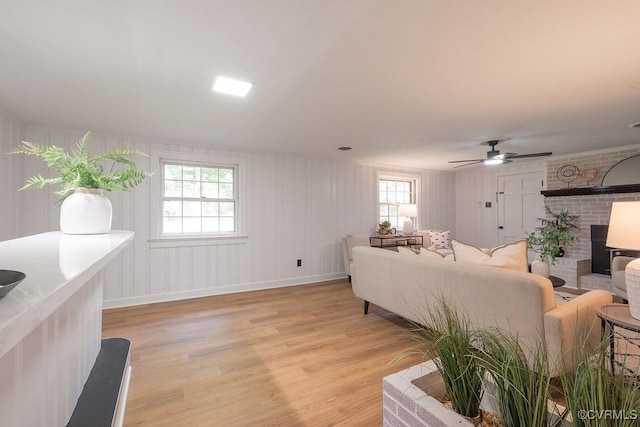5055 Edgemere Blvd, North Chesterfield, VA 23234 - living area with light wood-style floors, a fireplace, healthy amount of natural light, and a ceiling fan