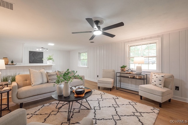5055 Edgemere Blvd, North Chesterfield, VA 23234 - living area featuring wood finished floors, ceiling fan, and a decorative wall