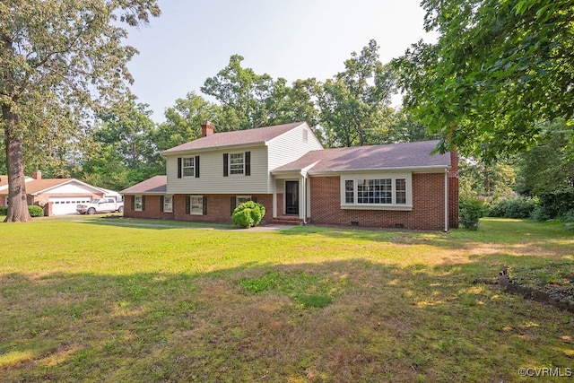 5055 Edgemere Blvd, North Chesterfield, VA 23234 - tri-level home with brick siding, a chimney, and a front lawn