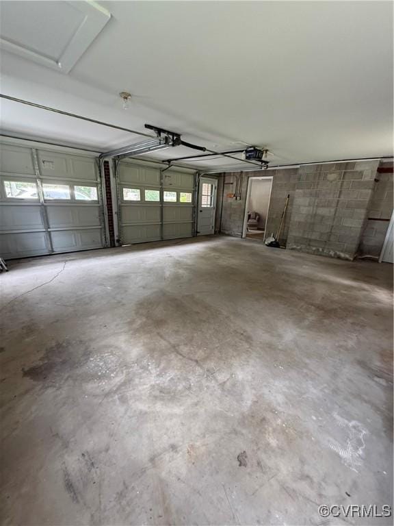 5055 Edgemere Blvd, North Chesterfield, VA 23234 - garage featuring a garage door opener and concrete block wall