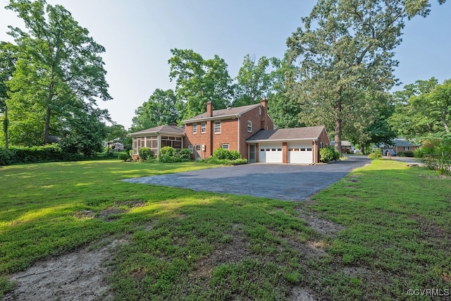5055 Edgemere Blvd, North Chesterfield, VA 23234 - view of front of home with driveway, an attached garage, a chimney, and a front yard