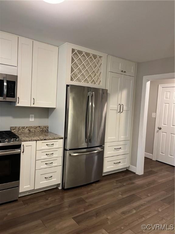 1184 Jamestown Rd Unit 19, Williamsburg, VA 23185 - kitchen with stainless steel appliances, light stone counters, white cabinetry, and dark wood finished floors