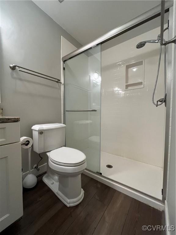 1184 Jamestown Rd Unit 19, Williamsburg, VA 23185 - bathroom featuring wood finished floors, toilet, a shower stall, and vanity