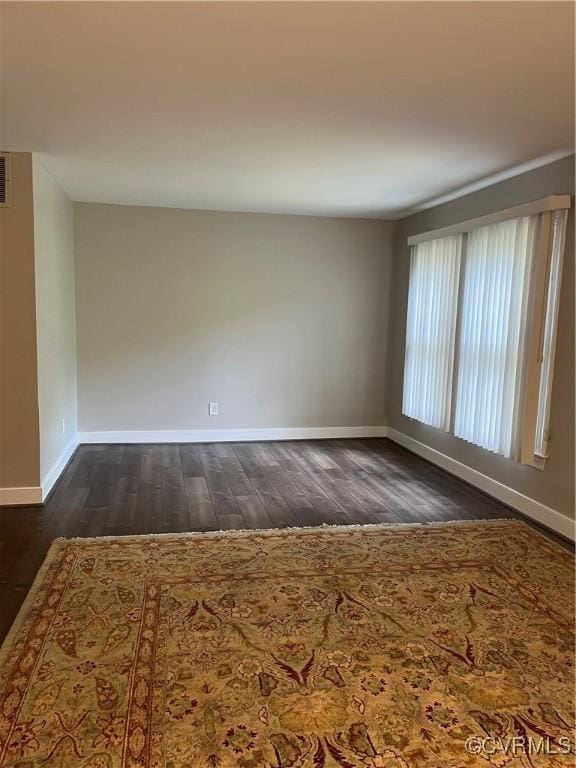 1184 Jamestown Rd Unit 19, Williamsburg, VA 23185 - empty room featuring dark wood-style floors and baseboards