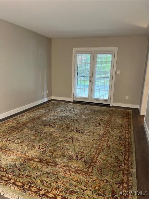 1184 Jamestown Rd Unit 19, Williamsburg, VA 23185 - spare room with baseboards and french doors