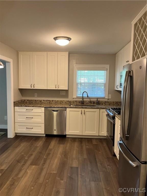 1184 Jamestown Rd Unit 19, Williamsburg, VA 23185 - kitchen with appliances with stainless steel finishes, dark stone counters, a sink, and white cabinets