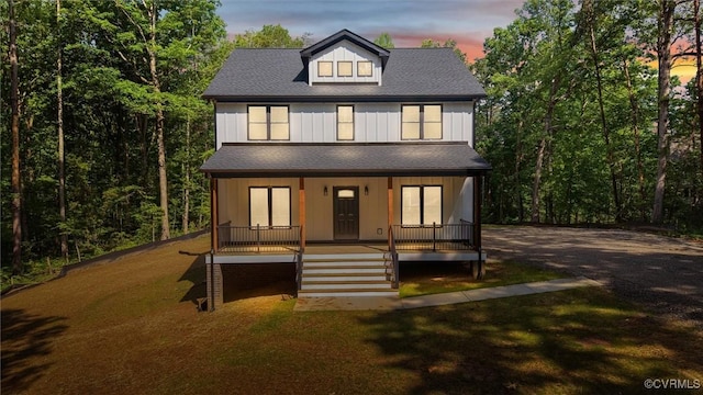 4062 Lake Killarney Rd, Gum Spring, VA 23065 - view of front of property featuring a porch, stairs, board and batten siding, and a yard