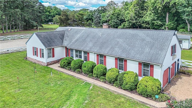 1468 Peppercorn Ln, Suffolk, VA 23432 - view of front of house with a chimney, a shingled roof, an attached garage, and view of wooded area