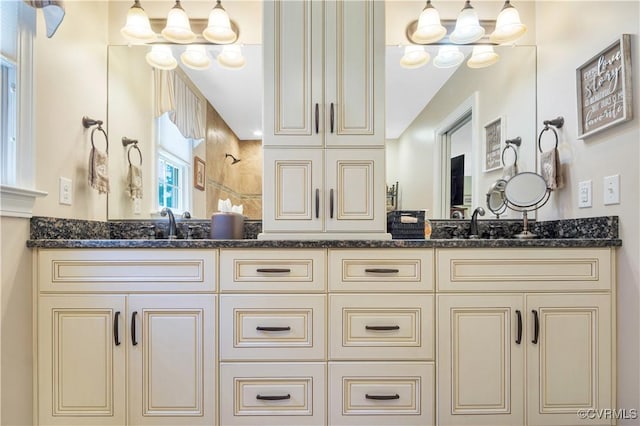 1468 Peppercorn Ln, Suffolk, VA 23432 - bathroom featuring double vanity, a tile shower, and a chandelier