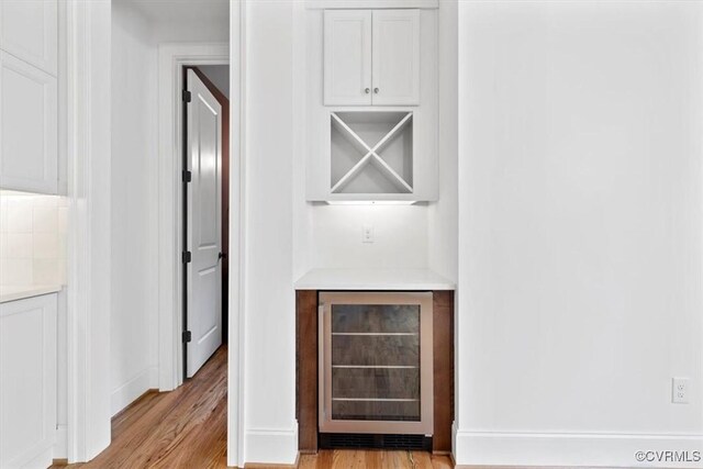 343 Petersburg Rd, Powhatan, VA 23139 - indoor dry bar with beverage cooler, light wood-style flooring, and baseboards