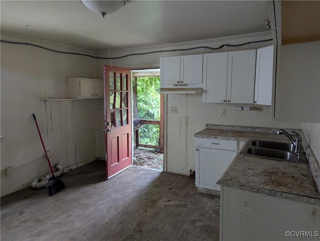 1224 Mckenzie St, Petersburg, VA 23803 - kitchen with a sink, white cabinetry, light countertops, and under cabinet range hood