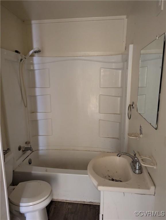 1224 Mckenzie St, Petersburg, VA 23803 - full bathroom with toilet, vanity, shower / washtub combination, and wood finished floors