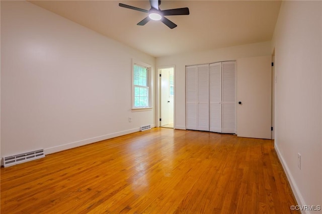 225 Philray Rd, Chesterfield, VA 23236 - unfurnished bedroom with light wood finished floors, baseboards, a closet, and ceiling fan