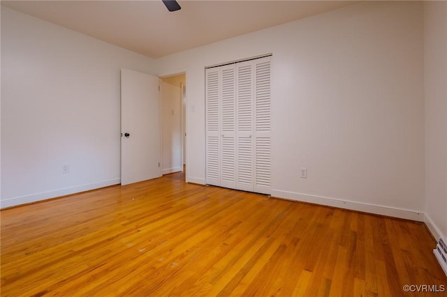 225 Philray Rd, Chesterfield, VA 23236 - unfurnished bedroom with light wood-style floors, a closet, baseboards, and baseboard heating