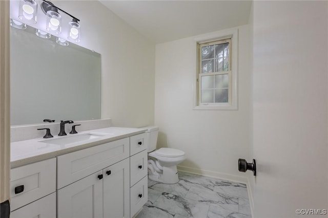 225 Philray Rd, Chesterfield, VA 23236 - bathroom featuring marble look tile flooring, vanity, toilet, and baseboards