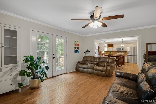 7727 Centerbrook Ct, Chesterfield, VA 23832 - living room with crown molding, ceiling fan, light wood finished floors, french doors, and baseboards