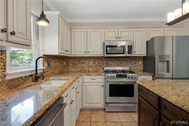 7727 Centerbrook Ct, Chesterfield, VA 23832 - kitchen featuring stainless steel appliances, a sink, crown molding, light tile patterned floors, and hanging light fixtures