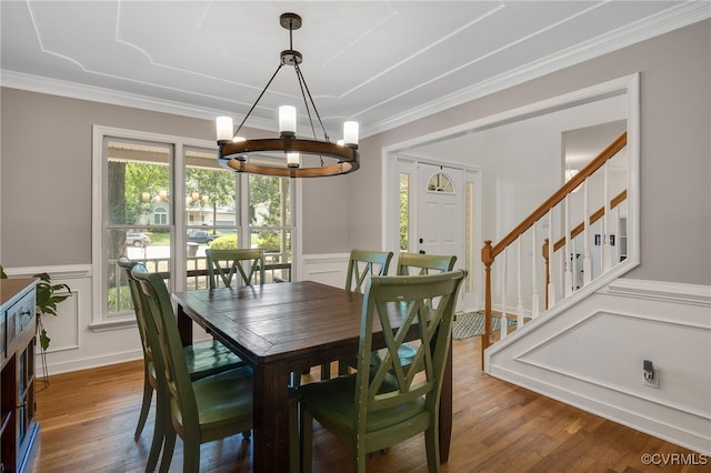 7727 Centerbrook Ct, Chesterfield, VA 23832 - dining room featuring a chandelier, ornamental molding, wood finished floors, a wainscoted wall, and a decorative wall