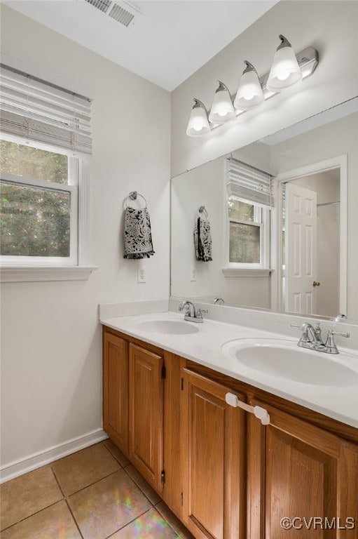 7727 Centerbrook Ct, Chesterfield, VA 23832 - bathroom featuring double vanity, tile patterned flooring, and baseboards