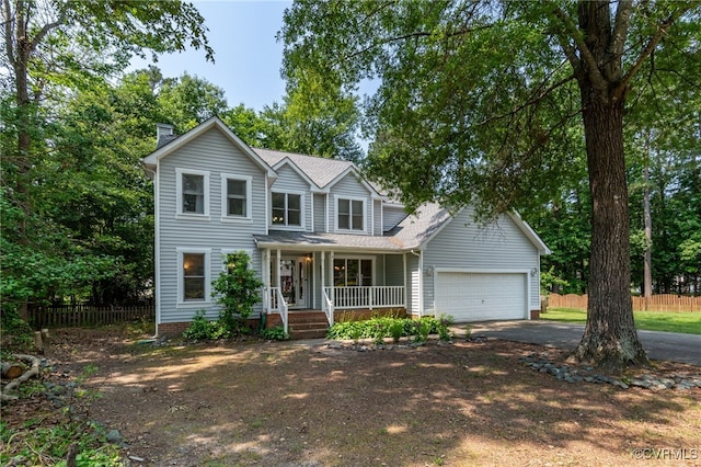 7727 Centerbrook Ct, Chesterfield, VA 23832 - traditional-style house featuring covered porch, driveway, a garage, a chimney, and a shingled roof
