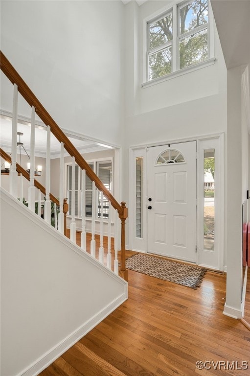7727 Centerbrook Ct, Chesterfield, VA 23832 - entryway featuring a towering ceiling, healthy amount of natural light, wood finished floors, and stairway