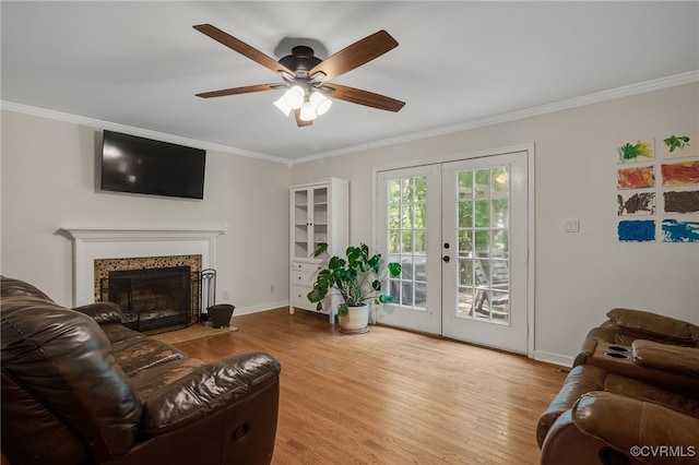 7727 Centerbrook Ct, Chesterfield, VA 23832 - living room with crown molding, wood finished floors, a ceiling fan, a fireplace with flush hearth, and baseboards