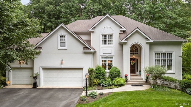 5225 Clipper Cove Rd, Chesterfield, VA 23112 - traditional-style home with stucco siding, driveway, roof with shingles, and a front lawn