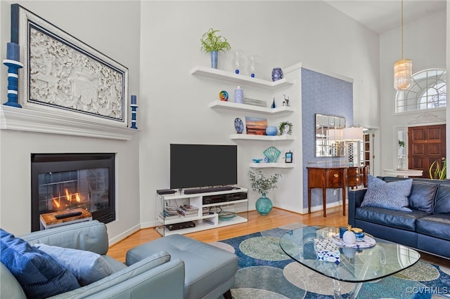 5225 Clipper Cove Rd, Chesterfield, VA 23112 - living room with a towering ceiling, wood finished floors, baseboards, and a glass covered fireplace
