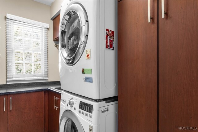 5225 Clipper Cove Rd, Chesterfield, VA 23112 - laundry room featuring stacked washer / dryer and cabinet space