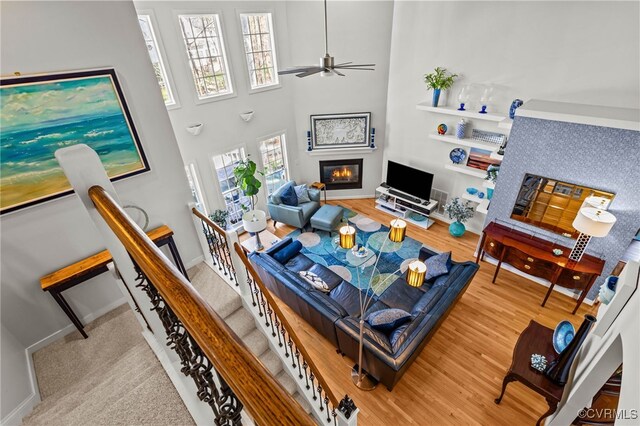 5225 Clipper Cove Rd, Chesterfield, VA 23112 - living area with a glass covered fireplace, wood finished floors, a ceiling fan, and baseboards