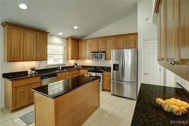 10132 Forrest Patch Dr, Mechanicsville, VA 23116 - kitchen with stainless steel appliances, a sink, vaulted ceiling, dark stone countertops, and brown cabinets