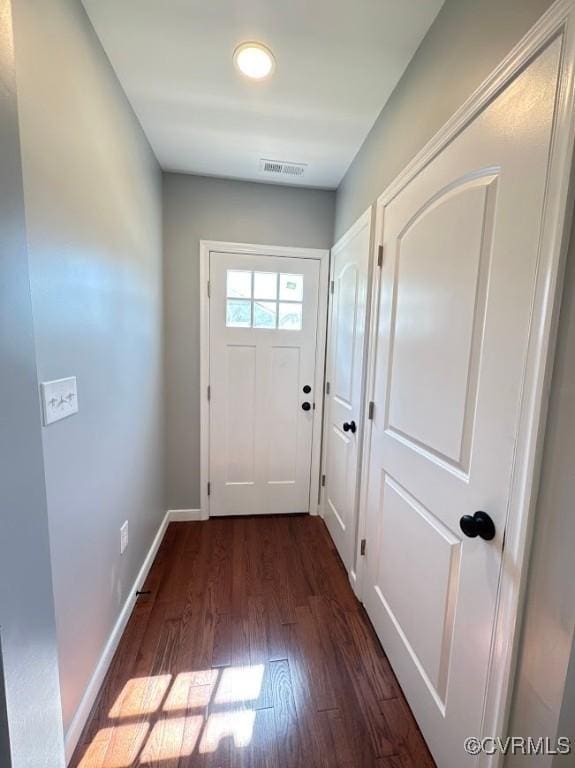 401 N 3 1/2 Ave, Hopewell, VA 23860 - doorway featuring dark wood-type flooring and baseboards