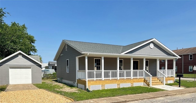 401 N 3 1/2 Ave, Hopewell, VA 23860 - view of front facade with a porch, a garage, concrete driveway, and an outbuilding