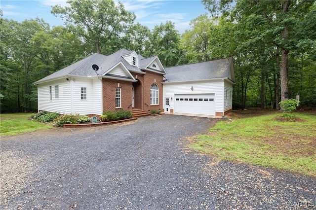 30 Highpockets Rd, Cartersville, VA 23027 - cape cod home featuring gravel driveway, a garage, and roof with shingles