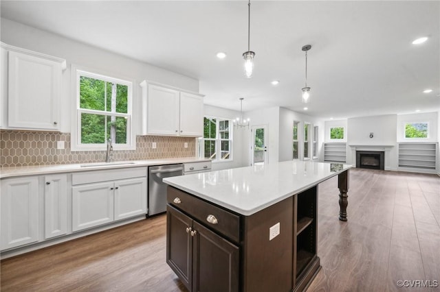 3805 Eastlook Ct, Powhatan, VA 23139 - kitchen featuring dishwasher, a sink, light wood-style flooring, light countertops, and white cabinetry