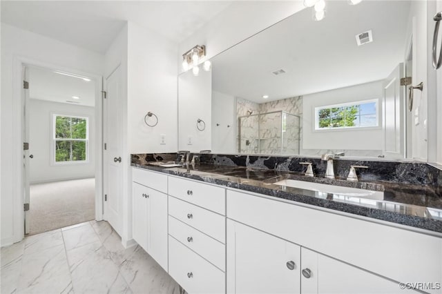 3805 Eastlook Ct, Powhatan, VA 23139 - full bath featuring double vanity, a marble finish shower, plenty of natural light, and marble look tile flooring