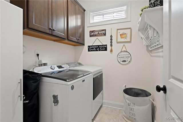 15719 Henningford Rd, Chesterfield, VA 23832 - laundry area featuring washer and dryer, cabinet space, light tile patterned floors, and baseboards
