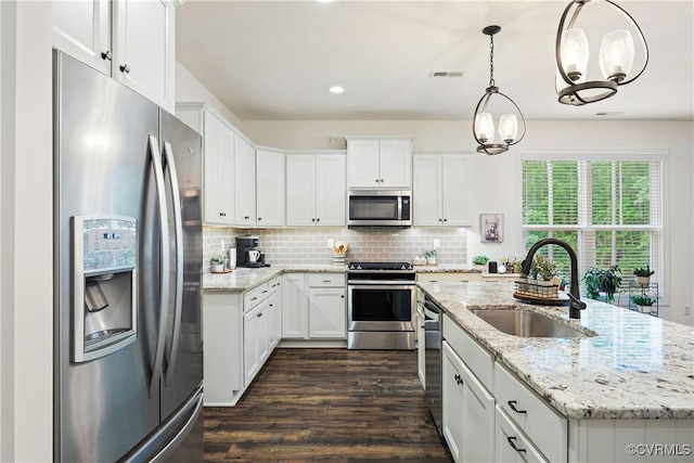 15719 Henningford Rd, Chesterfield, VA 23832 - kitchen featuring appliances with stainless steel finishes, a sink, dark wood-type flooring, white cabinets, and recessed lighting