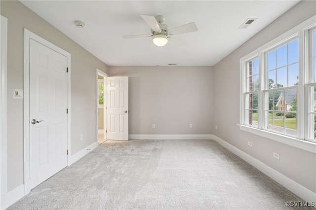 5308 Hillshire Way, Glen Allen, VA 23059 - unfurnished bedroom with multiple windows, light carpet, and ceiling fan