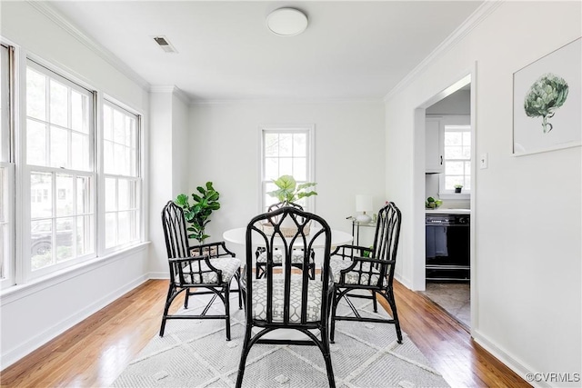 2619 Quarterpath Pl, Henrico, VA 23233 - dining space featuring light wood-style flooring, healthy amount of natural light, and ornamental molding