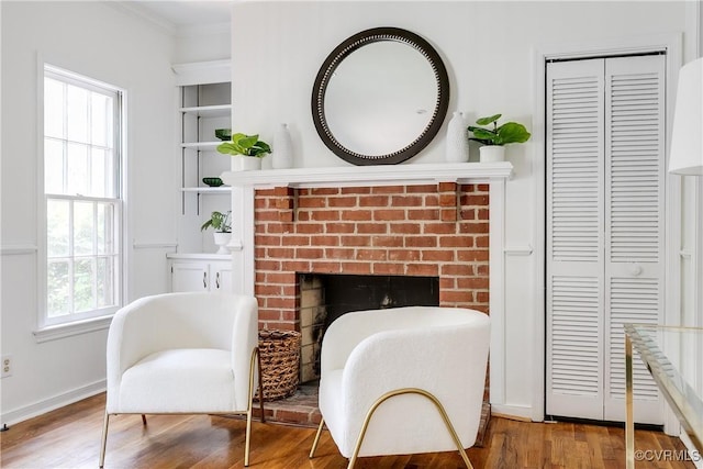 2619 Quarterpath Pl, Henrico, VA 23233 - sitting room with a brick fireplace, crown molding, and wood finished floors