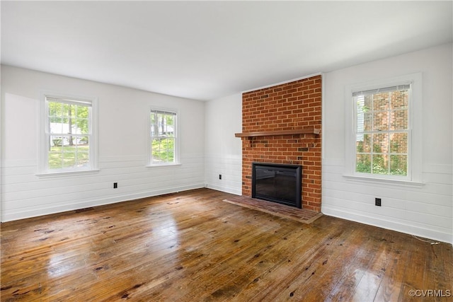 13917 Barnes Spring Rd, Midlothian, VA 23112 - unfurnished living room with hardwood / wood-style flooring, a fireplace, a wainscoted wall, and baseboards